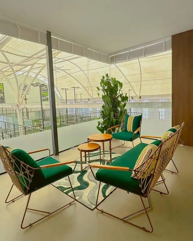 The VIP lounge: green chairs with striped cushions