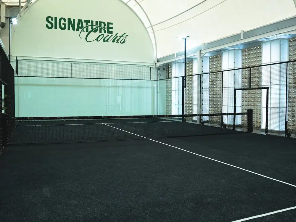 The Signature Courts hall with its dark turf and Signature Courts sign